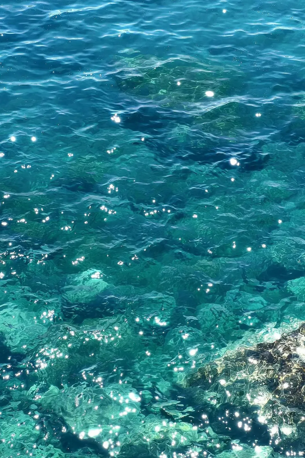 Clear turquoise water catching the sun.