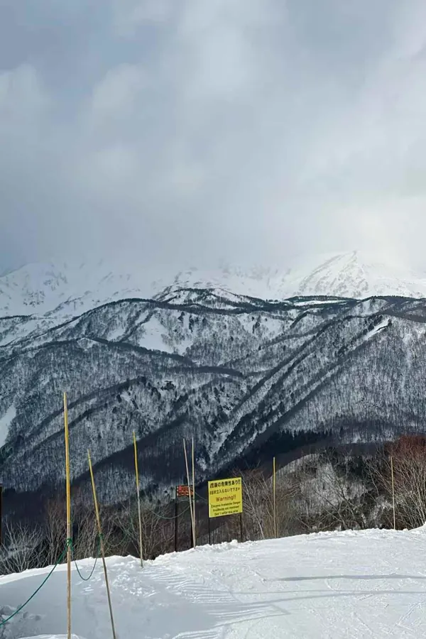 Snowy ridges above a ski area.